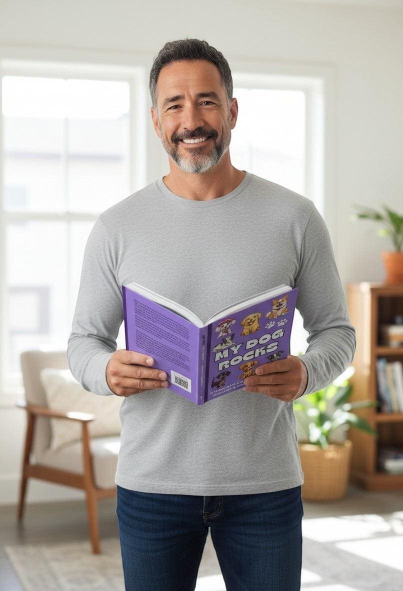 Thrive Collective Publishing My Dog Rocks keepsake journal with cartoon dogs on the cover, held by a smiling man.